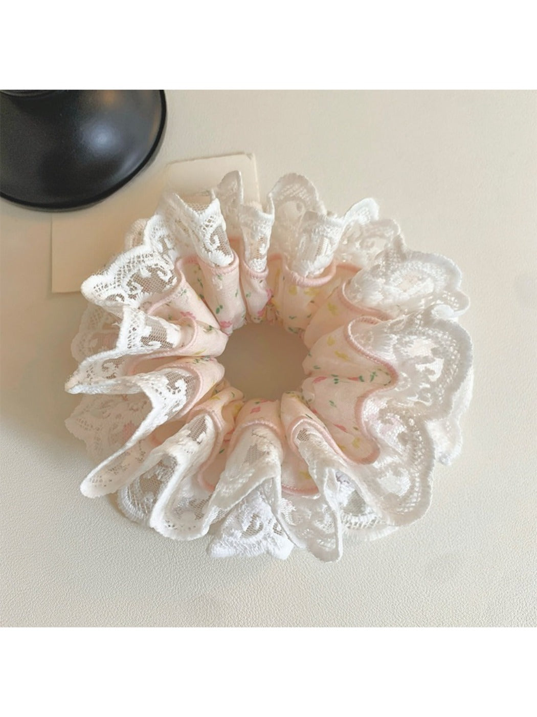 Close-up of Gifty sweet light pink scrunchie on white background