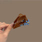 Side view of Beau triangular hair claw clip highlighting its sleek design