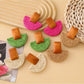 Close-up of Earedge raffia mushroom shaped stud earrings on white background