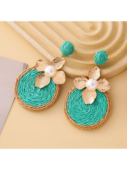 Detailed shot of Earedge circular floral drop earrings showing craftsmanship and texture