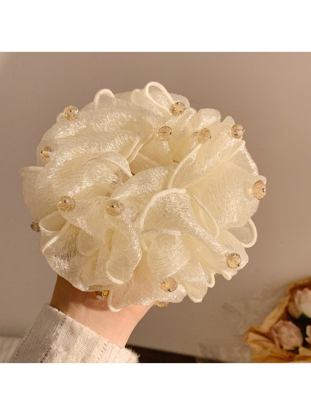 Gifty vintage scrunchie styled in hair, featuring bead accents and soft fabric