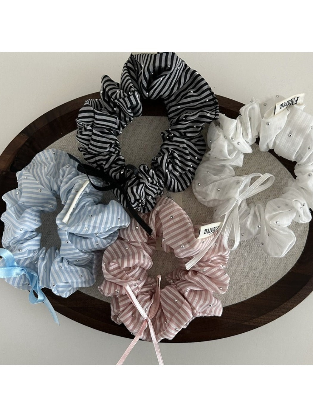 Gifty Sweet Bow Stripe Scrunchie displayed flat showing bow detail and striped pattern