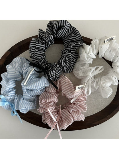 Gifty Sweet Bow Stripe Scrunchie displayed flat showing bow detail and striped pattern