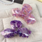 Side view of Beau bow hair claw clip highlighting curved teeth