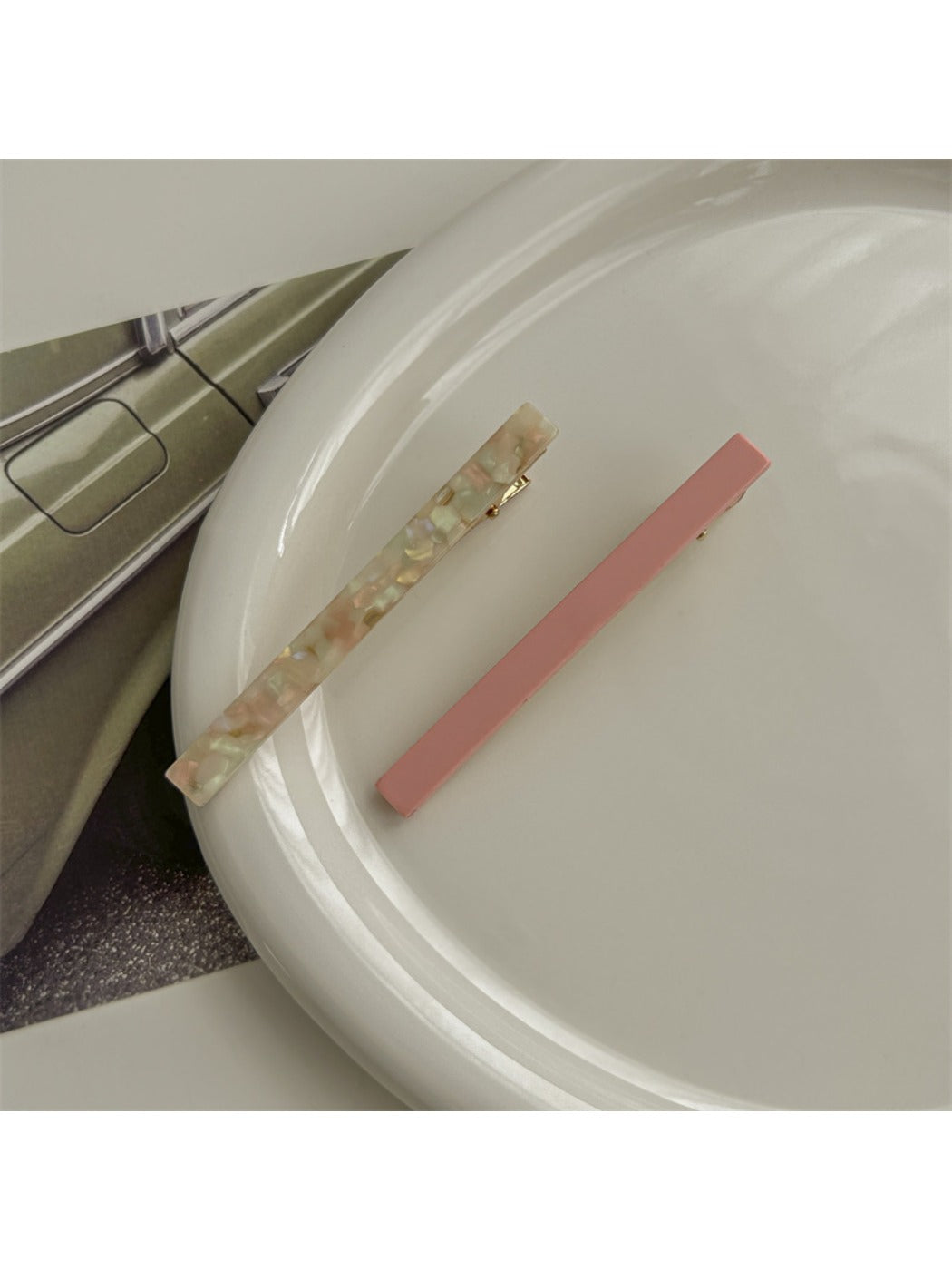 Top view of Beau acetate hair clip showing glossy tortoiseshell pattern