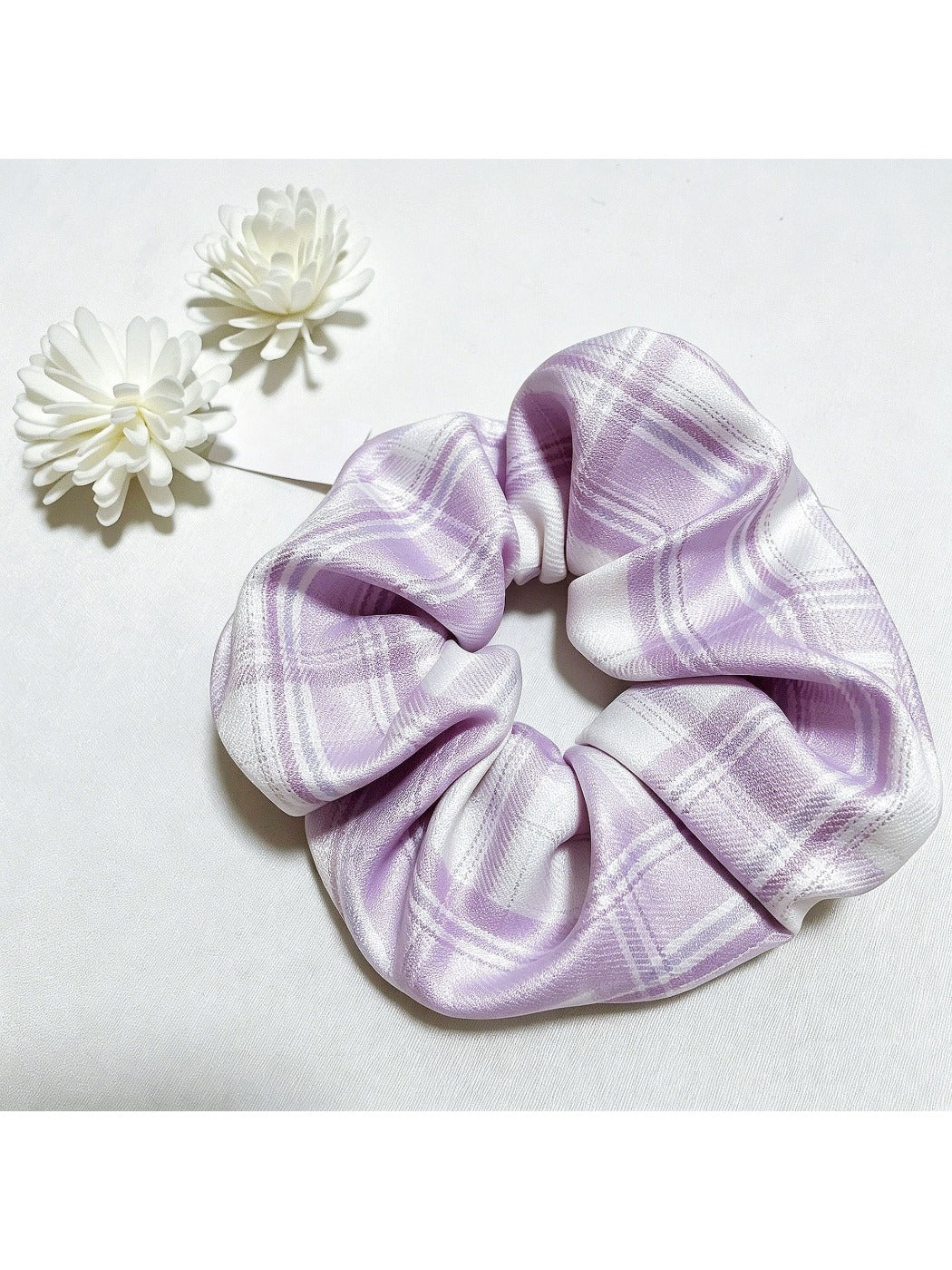 Gifty simple vintage plaid scrunchie styled on a wrist as an accessory