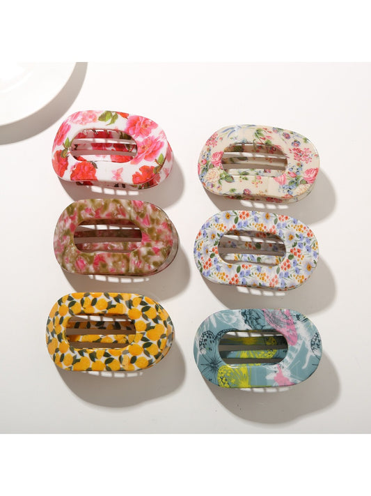 Beau fashionable hair clip with colorful geometric pattern on white background