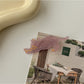Beau cat shaped hair clip styled in a casual hairdo