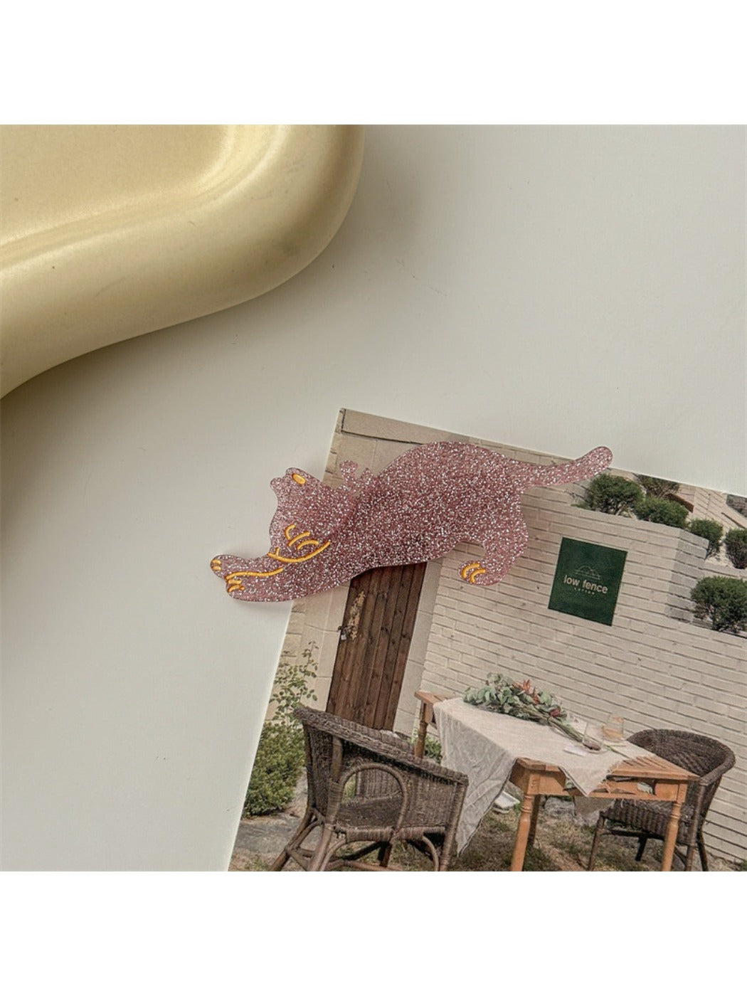 Beau cat shaped hair clip styled in a casual hairdo