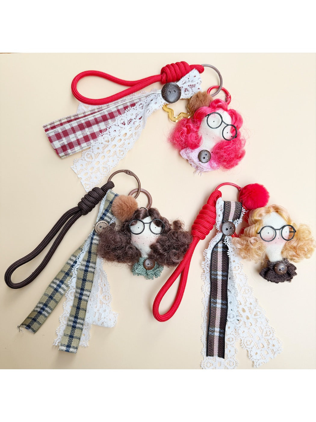 Fabric curly hair doll keychain with smiling face and colorful outfit