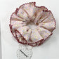Gifty scrunchie in vintage print worn in hair bun