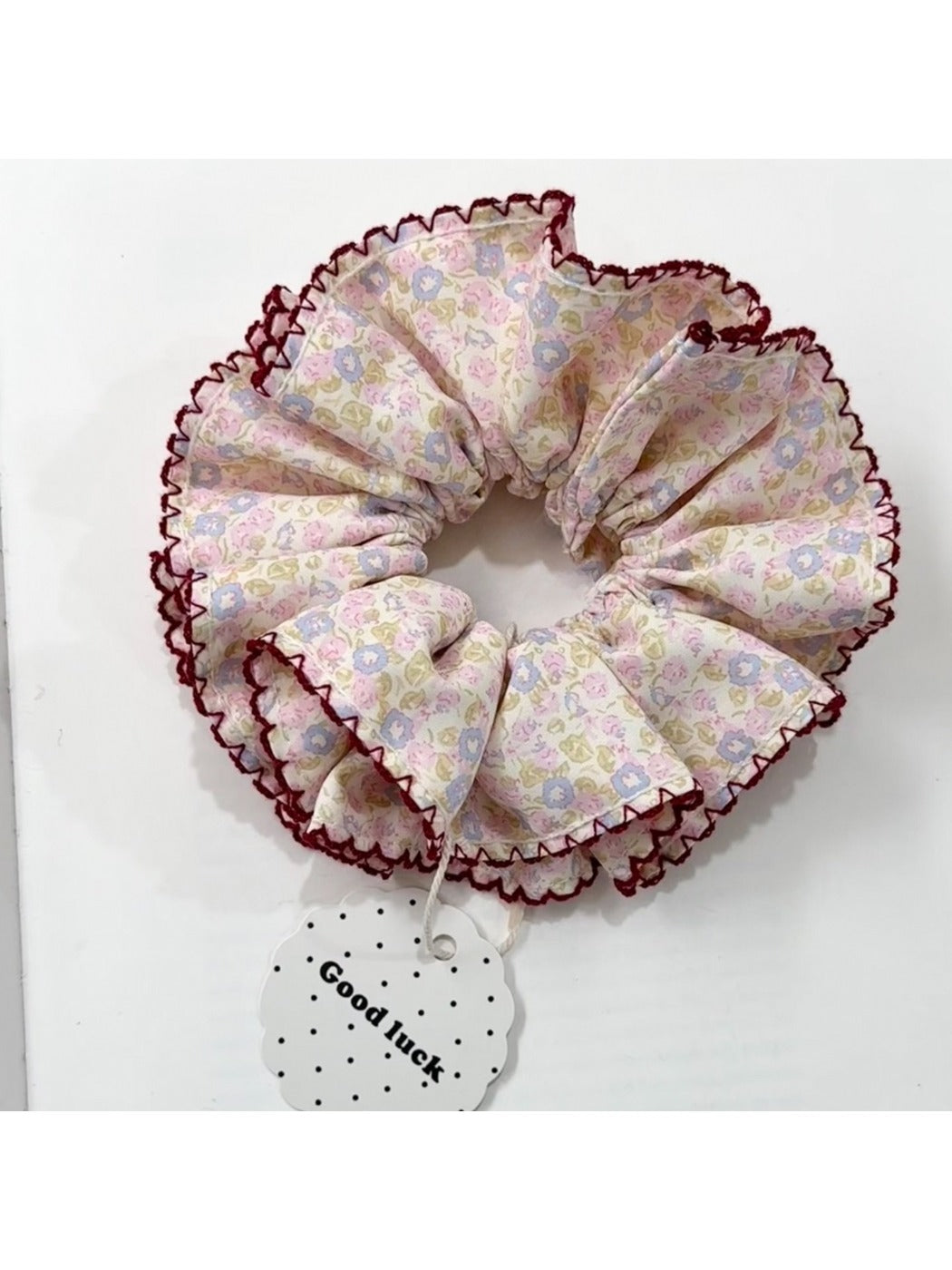 Gifty scrunchie in vintage print worn in hair bun
