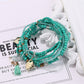 Lovra bracelet with heart pendant placed on textured surface for product display