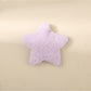 Beau star hair clip placed next to a ruler for size reference