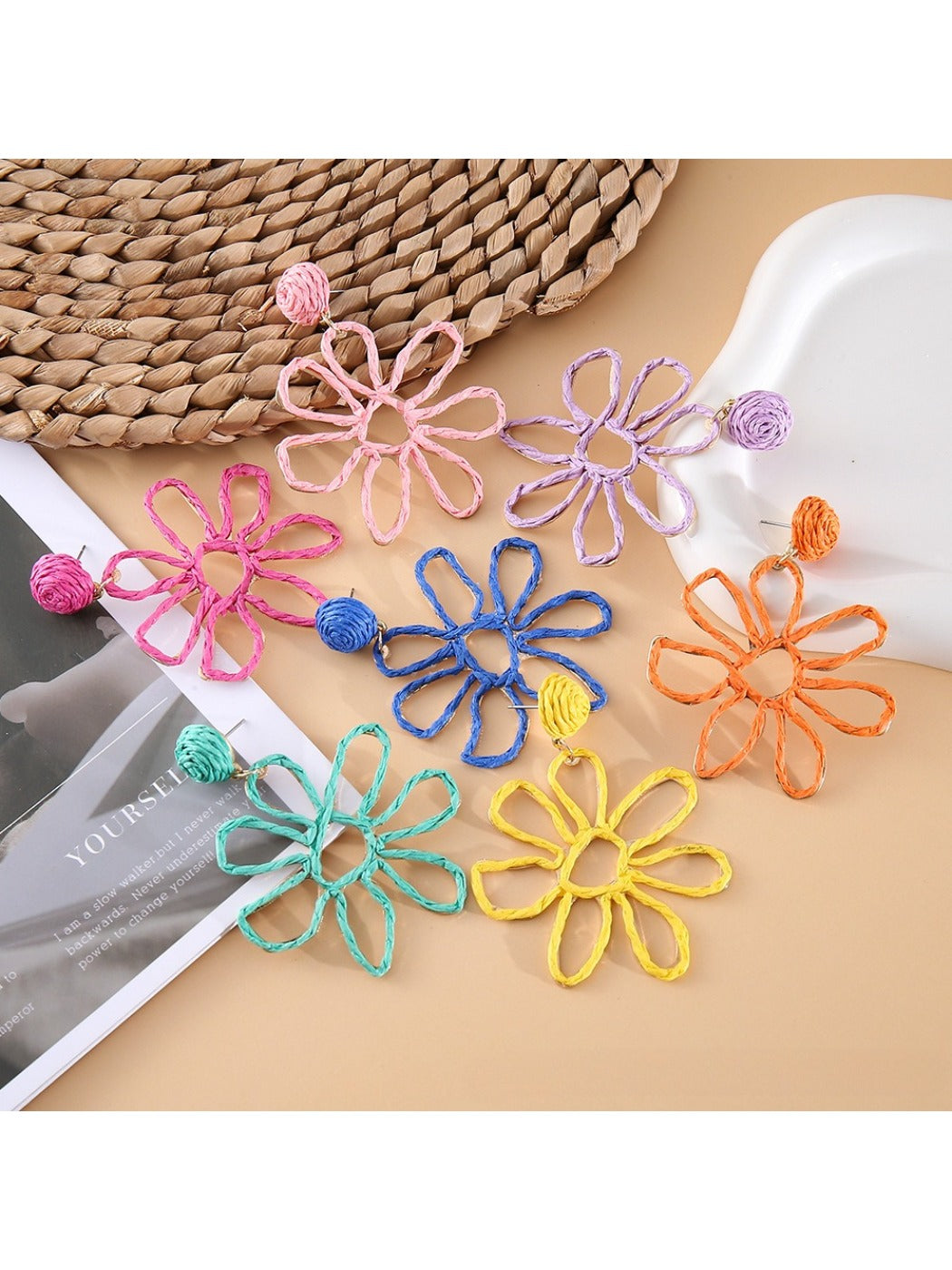 Close-up of Earedge flower shaped openwork drop earring with intricate petal design