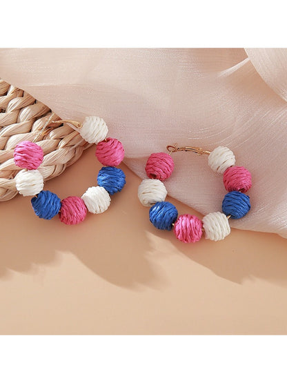 Earedge vintage raffia earrings worn by model with short hair