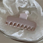 Beau hair clip styled in hair, highlighting its vivid colors and shape