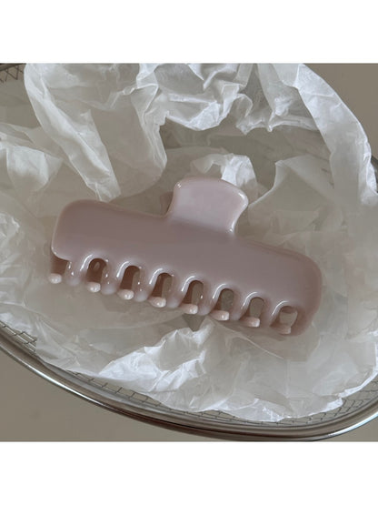 Beau hair clip styled in hair, highlighting its vivid colors and shape