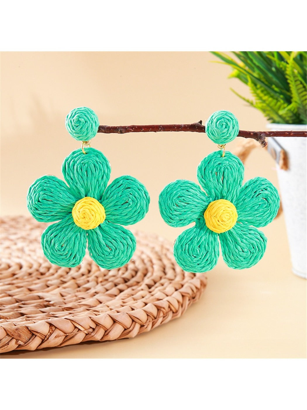 Side view of earedge knitted flower earrings showing the earring hook