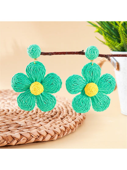 Side view of earedge knitted flower earrings showing the earring hook