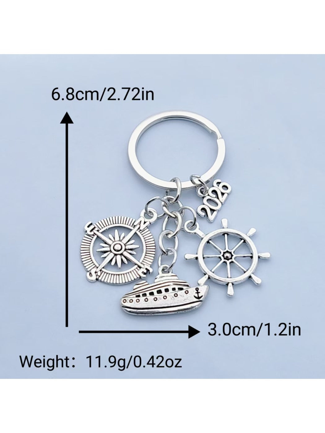 Steamship keychain attached to a keyring on a wooden surface