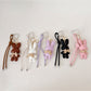 Front view of cartoon little bunny shaped keychain in pastel colors