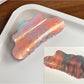 Beau hair claw clip holding thick hair with visible teeth grip