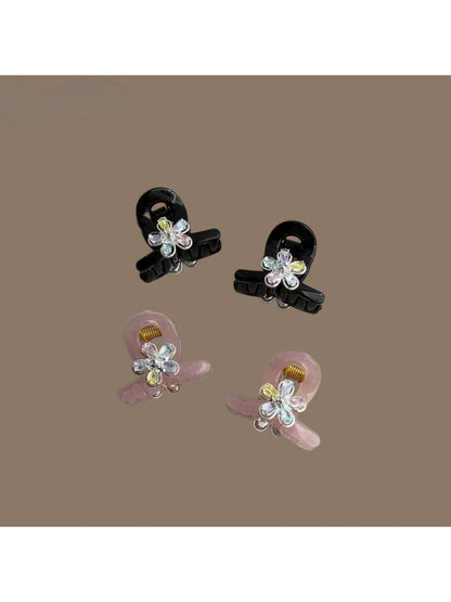 Close-up of Beau mini crisscross hair claw clip showing clasp mechanism