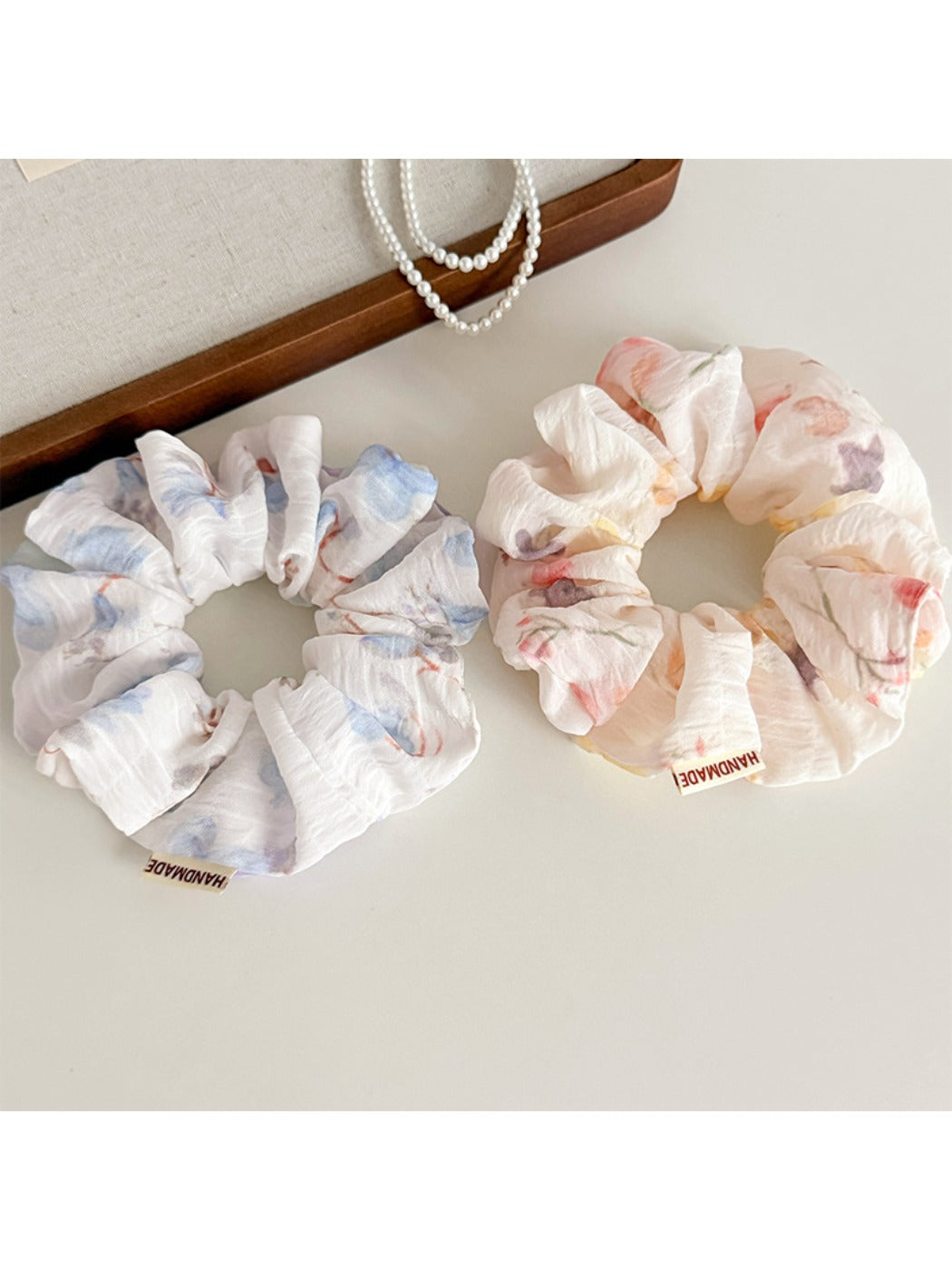 Close-up of Gifty scrunchie showing soft fabric texture and ombre color transition