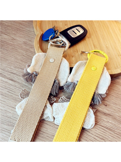 Keypus keychain held in hand displaying its compact size and fabric texture