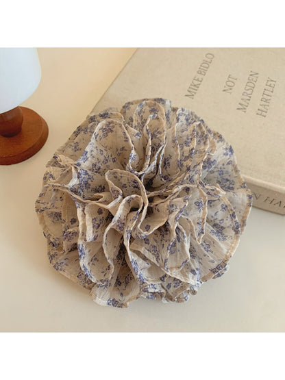 Close-up of Gifty vintage print scrunchie showing ruched texture and floral design