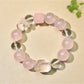 Close-up of Lovra minimalist pink beaded bracelet with gold accent beads on a white background