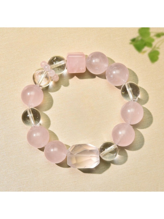Close-up of Lovra minimalist pink beaded bracelet with gold accent beads on a white background