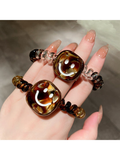 Gifty - Retro Spiral Cord Smiley Face Hair Tie