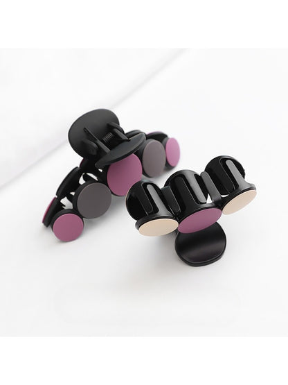 Beau hair clip attached to brown hair styled in loose waves