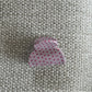 Beau pink polka dot claw clip displayed on a model’s hair from the back
