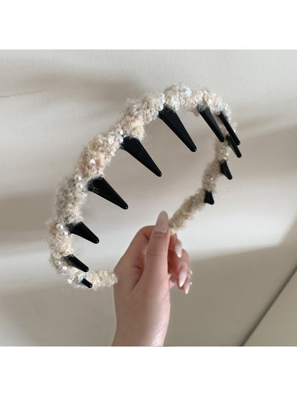 Gifty headband in pastel pink shown from top angle on neutral background