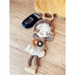 Keypus keychain displayed in a gift box with soft fabric lining