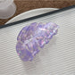 Beau leaf shaped hair claw clip held in hand showing size and shape