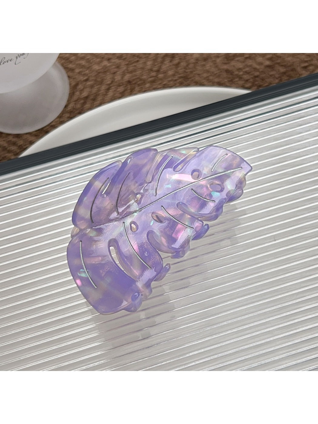 Beau leaf shaped hair claw clip held in hand showing size and shape