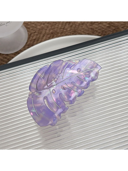 Beau leaf shaped hair claw clip held in hand showing size and shape