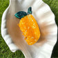 Green pear-shaped Beau acetate claw clip displayed on white background