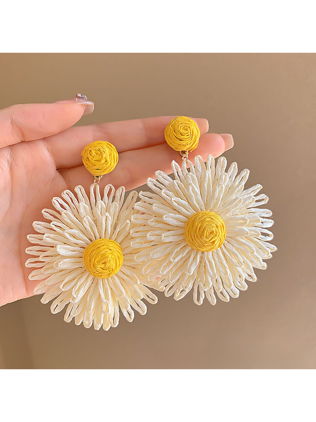 Model showcasing colorful floral raffia drop earrings with short hair