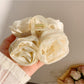 Side view of Beau elegant hair claw clip highlighting curved shape and rose embellishments