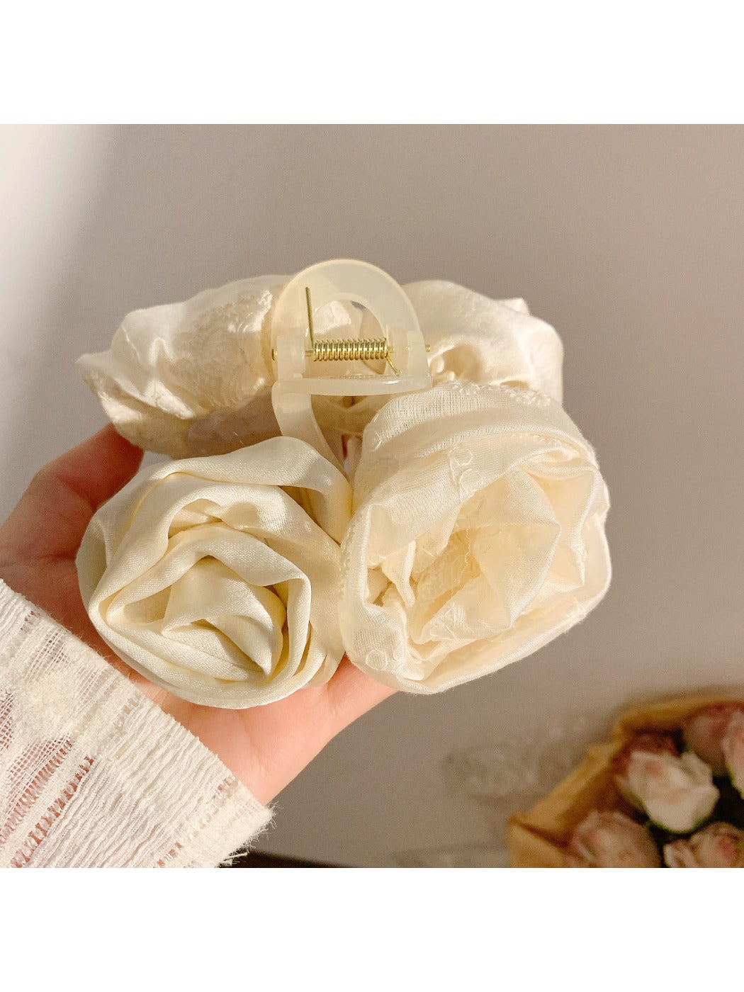 Side view of Beau elegant hair claw clip highlighting curved shape and rose embellishments