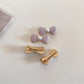 Side view of Beau bow hair clip highlighting its curved shape