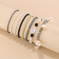 Lovra fashionable beaded bracelet with shell accents on a white background