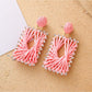 Earedge raffia square drop earrings photographed with natural lighting