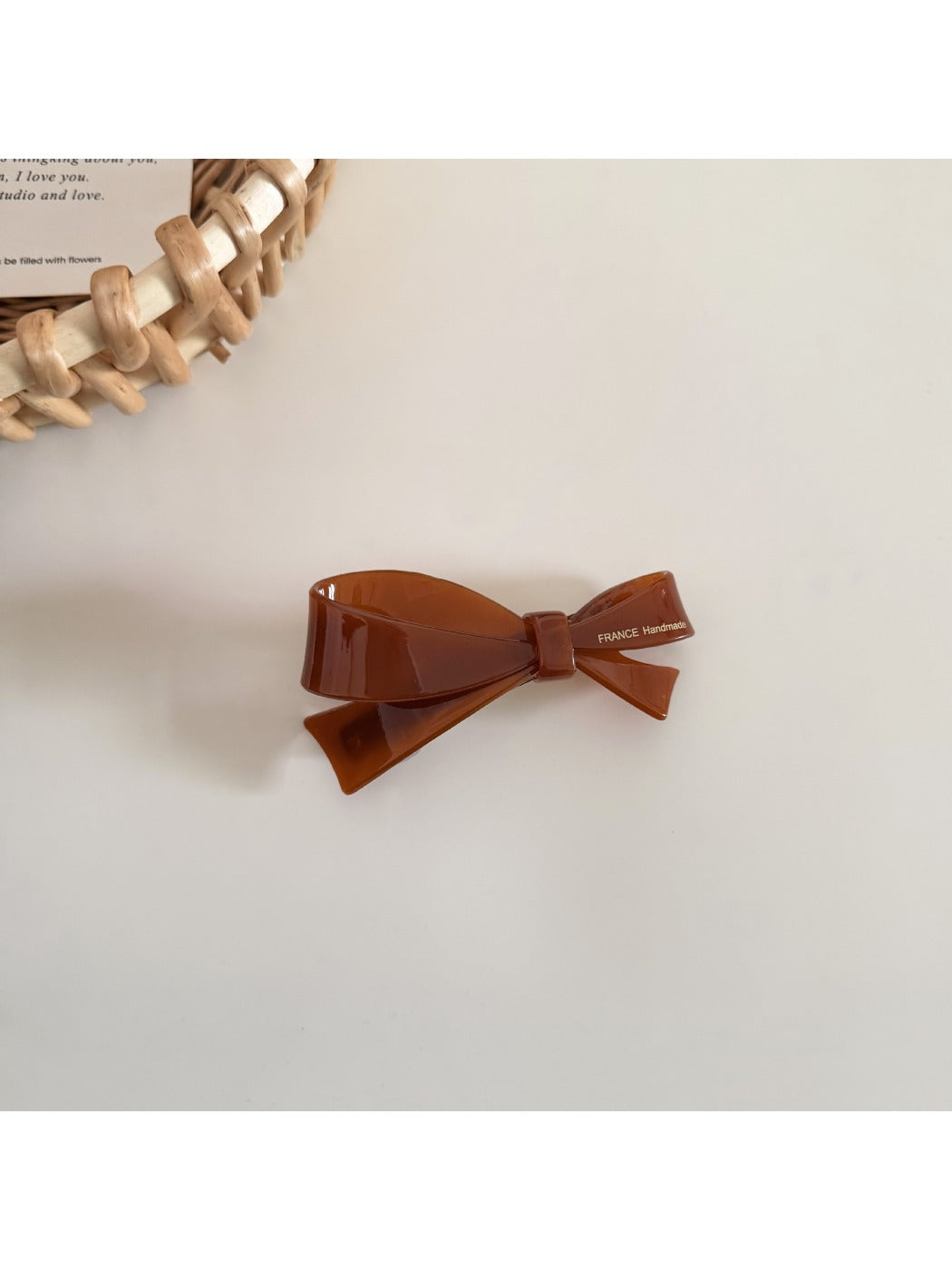 Top view of Beau irregular bow hair clip displaying fabric folds