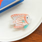 Beau tropical fish acetate hair clip angled to show fish tail and fin details